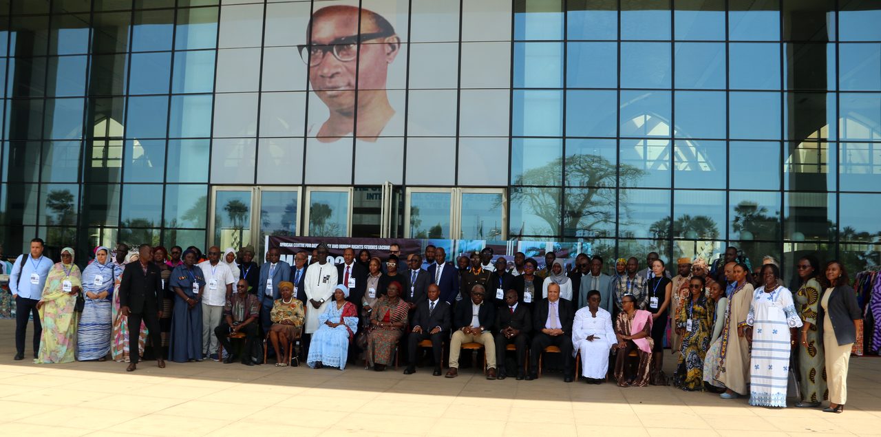 Delegates of the Forum on the Participation of NGOs in the 87th Ordinary Session of the ACHPR, gathered outside the Sir Dawda Kairaba Jawara International Conference Centre in Banjul, May 2026